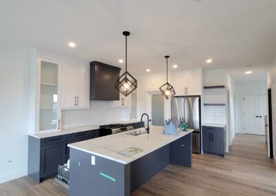 Modern kitchen under pre delivery inspection, with green tape marking visible defects for correction.