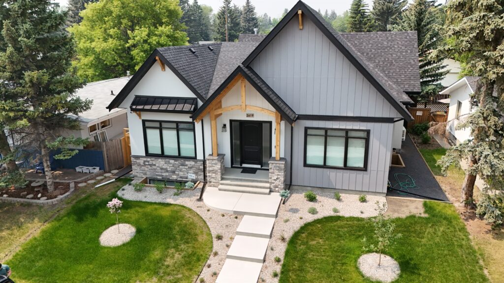 Modern Calgary home exterior with pitched rooflines and contemporary cladding, shown during residential property inspection context
